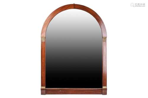A French Empire-style mahogany over mantle mirror of arched ...