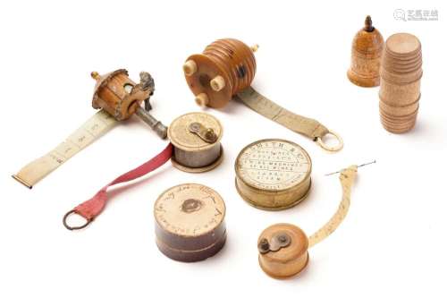A 19th century sewing tape measure in the form of a beehive,...