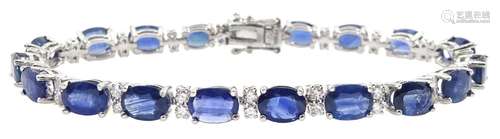 Platinum oval sapphire and round brilliant cut diamond brace...