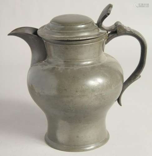 AN EARLY PEWTER ALE JUG AND COVER. 9ins high.
