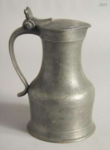 A SMALL TAPPET HEN PEWTER FLAGON AND COVER 7ins high.