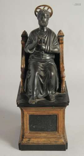 AFTER THE ANTIQUE. A 19TH CENTURY BRONZE SAINT SITTING ON A ...