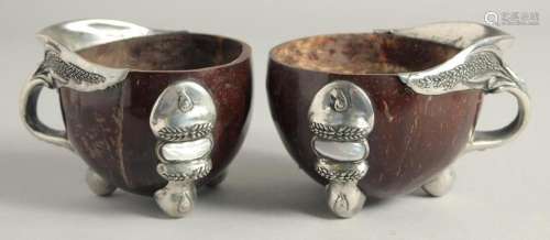 A PAIR OF SILVER MOUNTED COCONUT CUPS 4ins