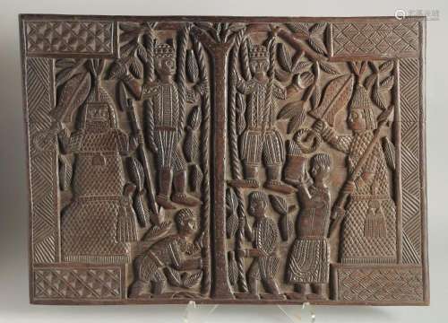 A WELL CARVED BENIN WOOD PANEL formed as two connecting pane...