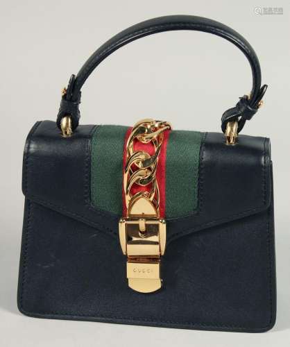 A GOOD GUCCI SMALL CLUTCH BAG 7.5ins x 5.5ins with gilt Gucc...