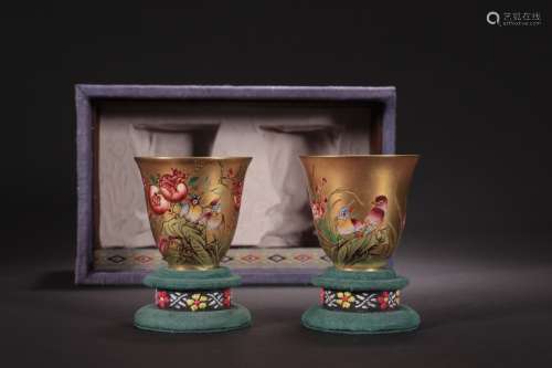 A pair of gold-glazed enamel colored bell cups