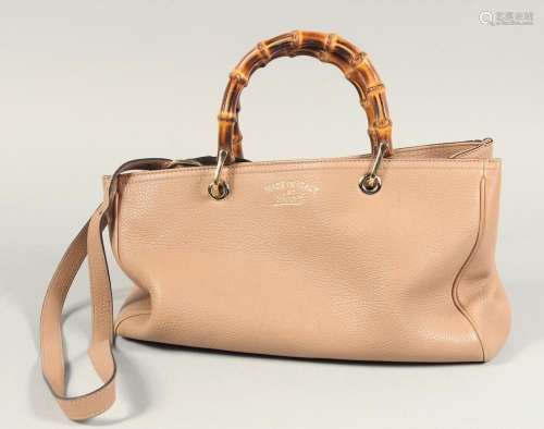 A GUCCI TWO HANDLED LEATHER BAG 13ins x 7.5ins with two bamb...