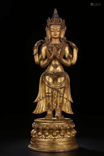 Gilt bronze four-armed Guanyin statue