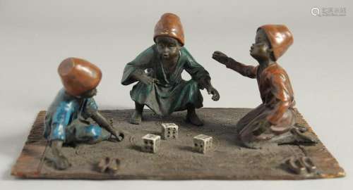 A VIENNA COLD CAST PAINTED GROUP OF THREE BOYS PLAYING DICE ...