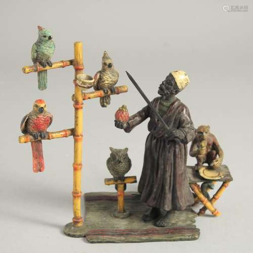 A VIENNA COLD CAST PAINTED GROUP OF THE PARROT VENDOR a monk...