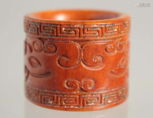 A CARVED BONE ARCHER S RING. 1.25ins.