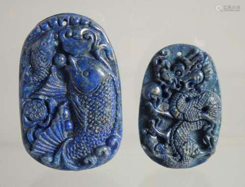 TWO CARVED LAPIS PENDANTS.