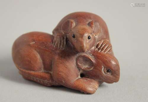 A WOODEN NETSUKE OF TWO RATS. 2ins long.