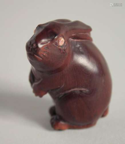 A WOODEN NETSUKE OF A RABBIT. 1.75ins.