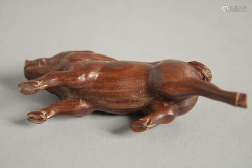 A BONE NETSUKE OF A BOAR. Signed, 2.5ins.