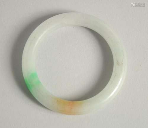 A JADE BANGLE.