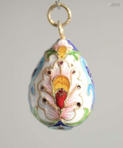 A RUSSIAN SILVER AND ENAMEL EGG PENDANT. 1ins long.