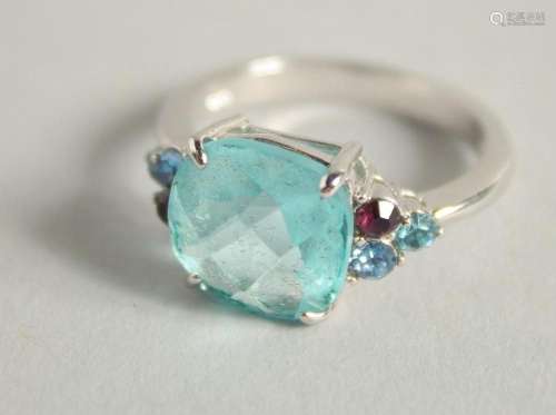 A SILVER AND GEMSTONE RING.