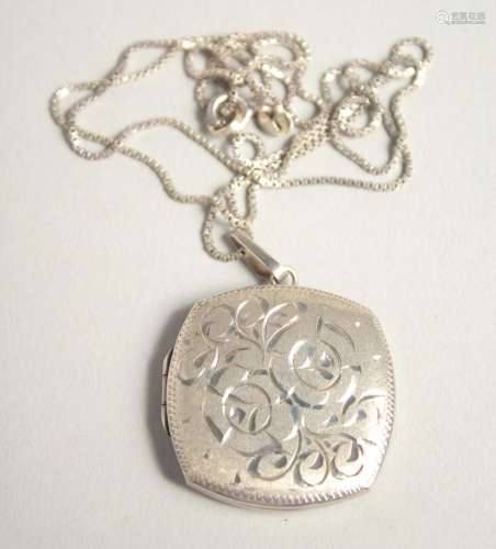 A SILVER LOCKET AND CHAIN.