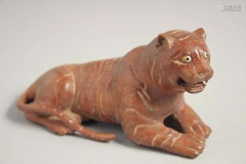 A CARVED WOOD TIGER. 5.5ins long.