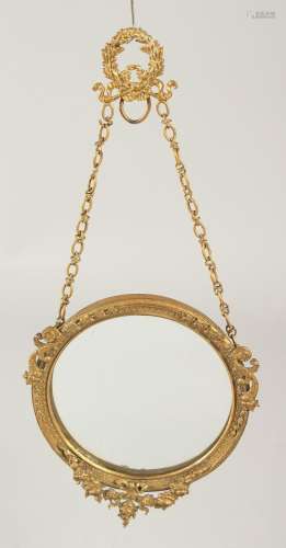 A GILT METAL CIRCULAR PHOTOGRAPH FRAME 3.5ins