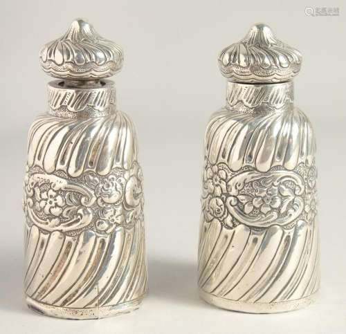 TWO VICTORIAN SILVER SCENT BOTTLES AND STOPPERS. 5ins high.