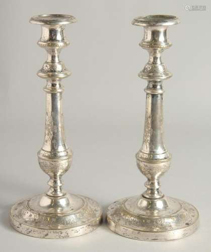 A PAIR OF FRENCH PLAIN CANDLESTICKS. 9.5ins high.