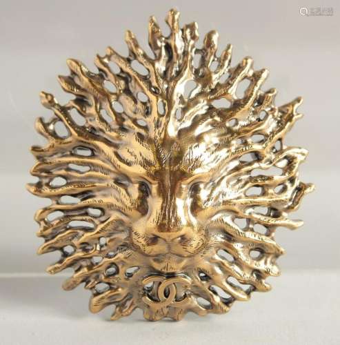 A CHANEL GILT COSTUME LION HEAD BROOCH with white label and ...