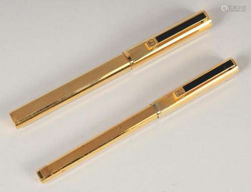 TWO DUNHILL GILT PENS, a ballpoint and fountain pen.