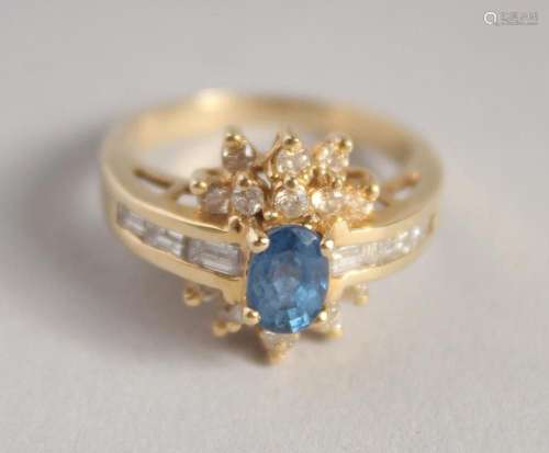 A GOLD SAPPHIRE AND DIAMOND CLUSTER RING.