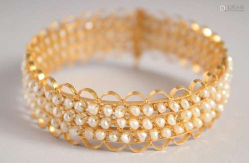 A GOOD GOLD AND THREE ROW SEED PEARL BRACELET.