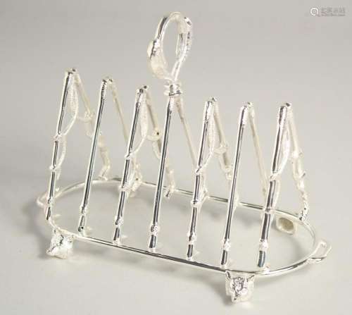 A SILVER PLATED SIX DIVISION TOAST RACK, riding crops and fo...