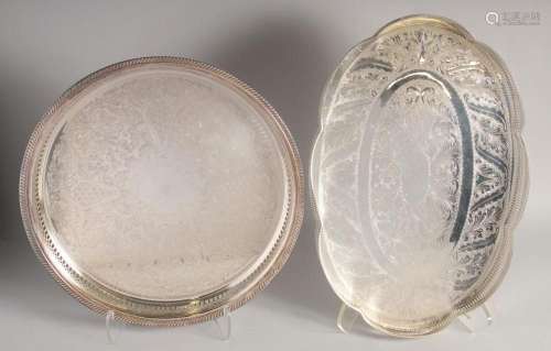 TWO SILVER PLATED TRAYS WITH GALLERIES. 14ins diameter and 1...
