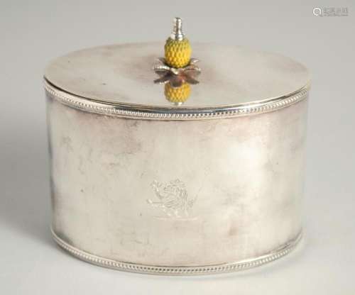 A REPRODUCTION SILVER PLATED OVAL TEA CADDY with pineapple f...