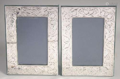 A PAIR OF PLAIN SILVER UPRIGHT PHOTOGRAPH FRAMES embossed wi...