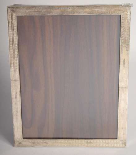 A SILVER UPRIGHT PHOTOGRAPH FRAME. 10ins x 8ins.