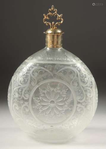 A CONTINENTAL ROUND ETCHED GLASS DECANTER with silver rim an...