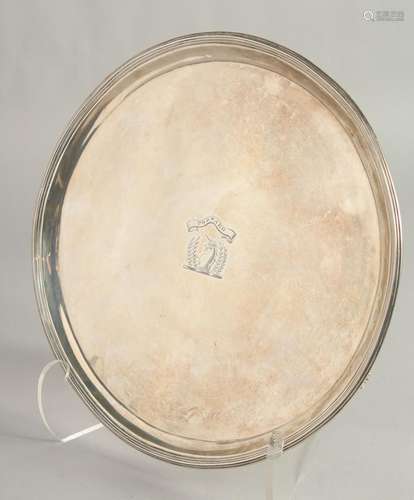 A GEORGE III SILVER CIRCULAR SALVER, 9.5ins diameter, with r...