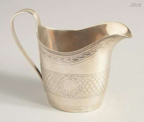 A GEORGE III SILVER CREAM JUG with reeded edge and engraved ...