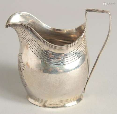 A GEORGE III SILVER CREAM JUG with reeded edge and engraved ...