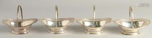A SET OF FOUR SMALL SILVER OVAL PIERCED BASKETS with swing h...