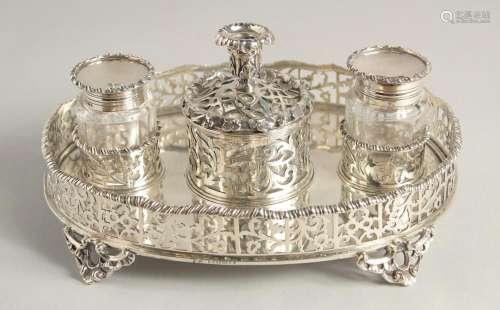 A SUPERB VICTORIAN SILVER OVAL INKSTAND with pierced gallery...