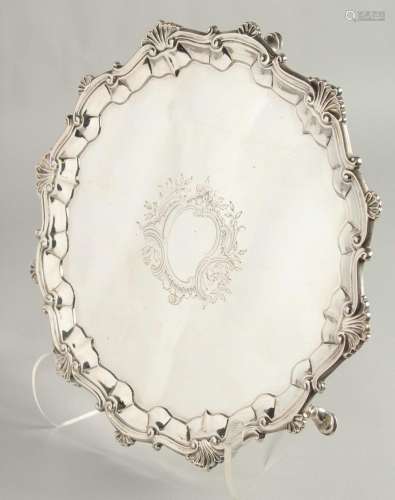 A GOOD GEORGE III SILVER SALVER with pie crust and bell bord...