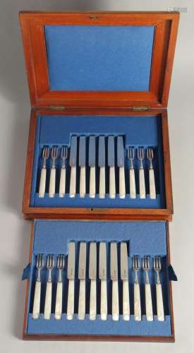 A CANTEEN OF 12 SILVER AND MOTHER OF PEARL FRUIT KNIVES. She...