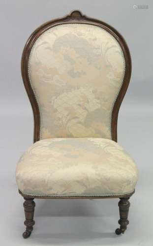 A VICTORIAN MAHOGANY FRAMED NURSING CHAIR with padded back a...