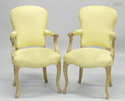 A PAIR OF FRENCH HEPPLEWHITE GILDED ARMCHAIRS with yellow pa...