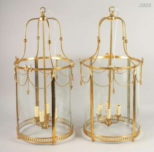 A VERY GOOD PAIR OF GILT CIRCULAR LANTERNS with glass panels...