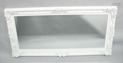 A LARGE WHITE PAINTED MIRROR. 5ft 6ins x 2ft 8ins.