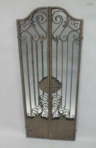 A MIRRORED BACK CAST IRON GATE. 5ft high.