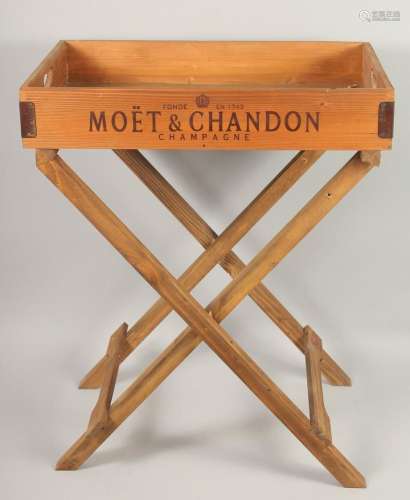 A WOODEN MOET & CHANDON BUTLER S TRAY AND STAND. 2ft 2in...